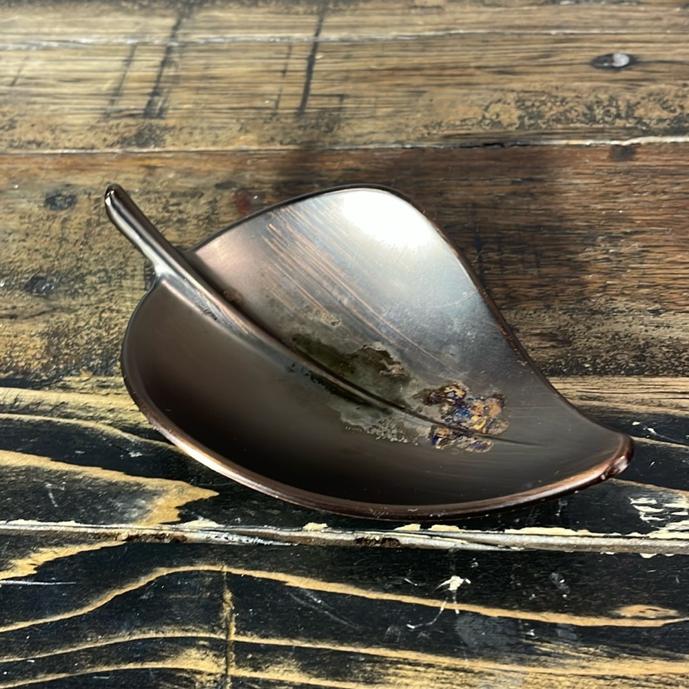 Umbra ring holder. Metal. Rings not included. Some marks on inside of dish.